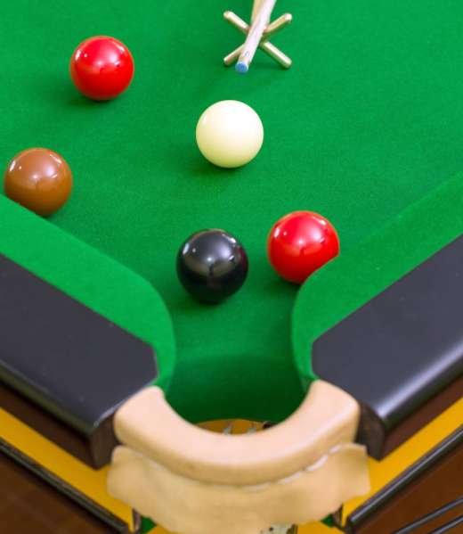 Snooker balls on the snooker table.